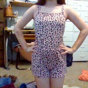 a pink leopard printed romper